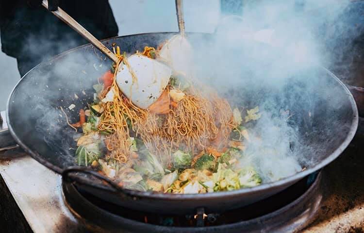 Hot wok with noodles and vegetables